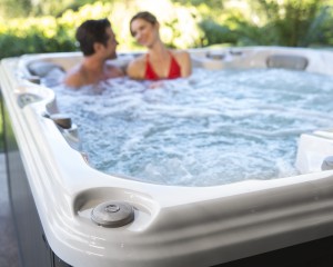 Man and woman in a 6-person hot tub.