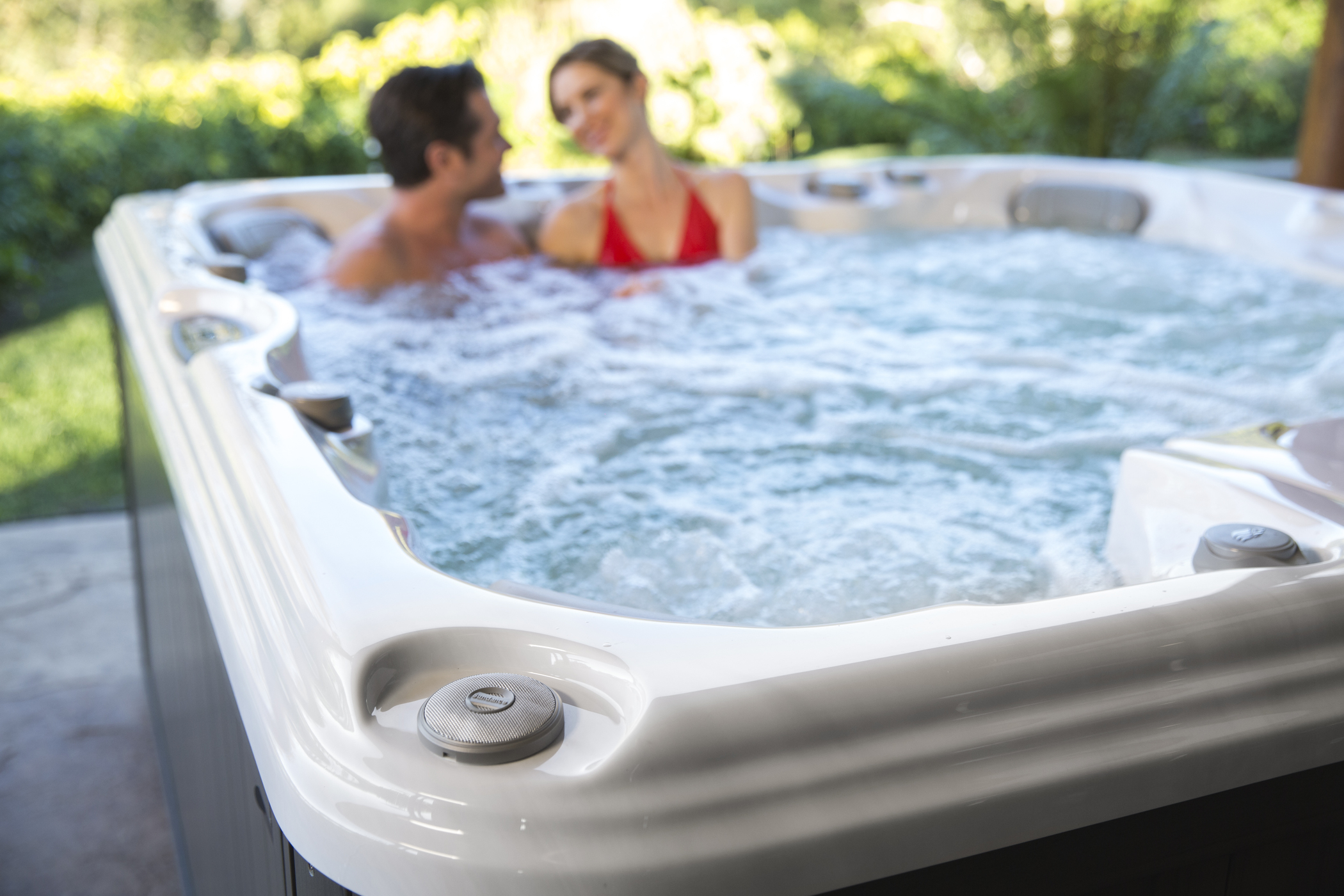 Man and woman in a 6-person hot tub.