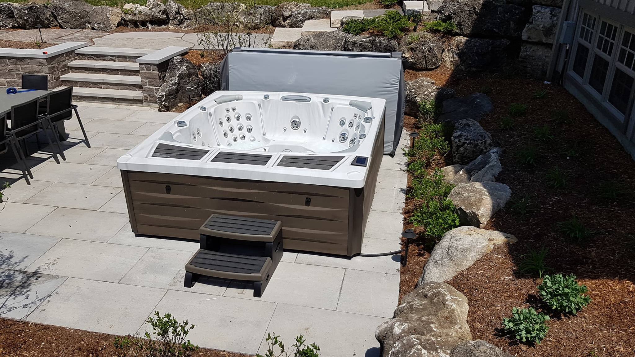 Kingston hot tub from Sundance Spas installed in a backyard space. Kingston hot tub from Sundance Spas installed in a backyard space.