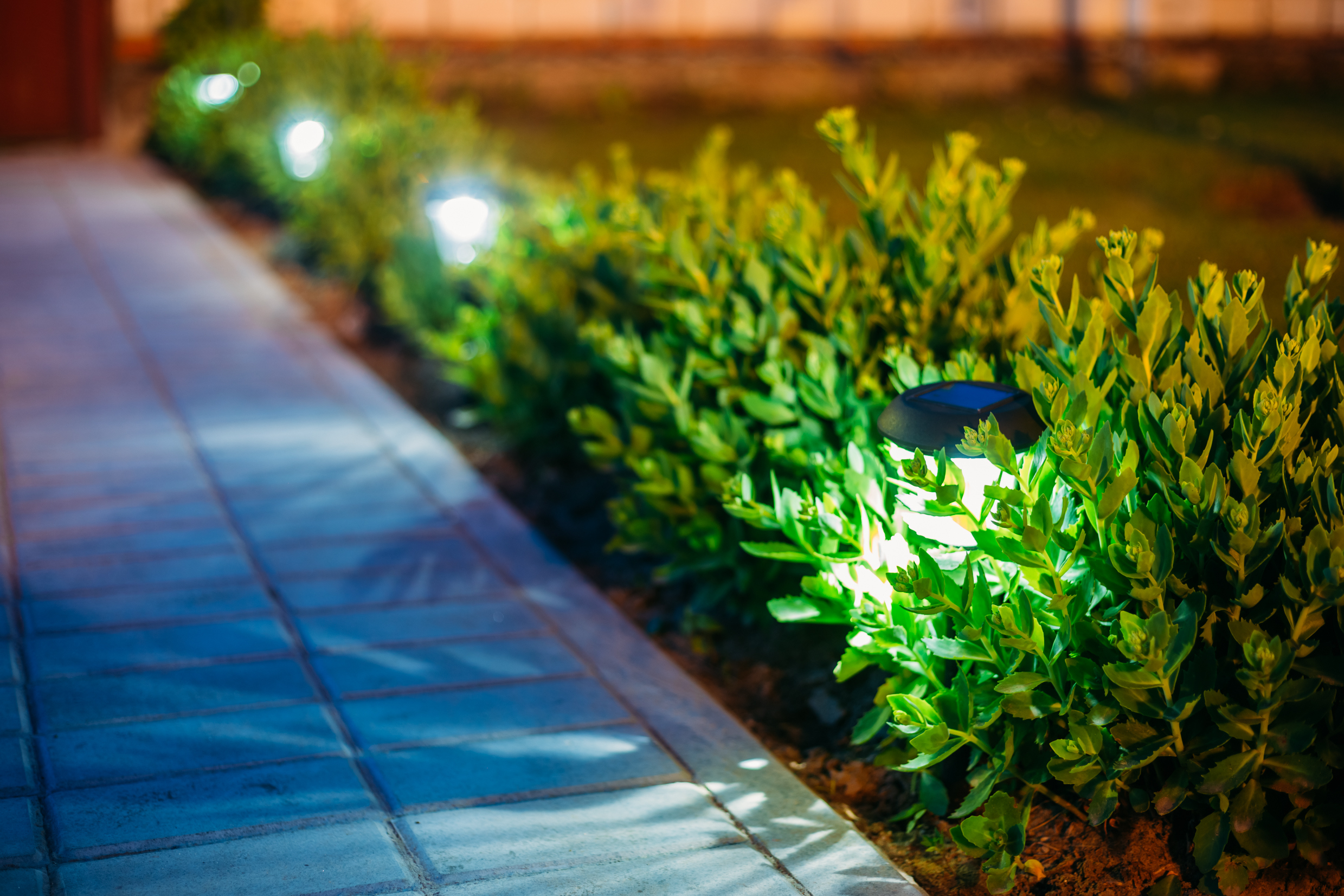 Illuminated walkway at night.