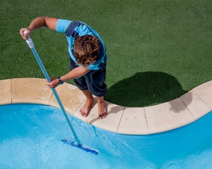 Man winterizing swimming pool