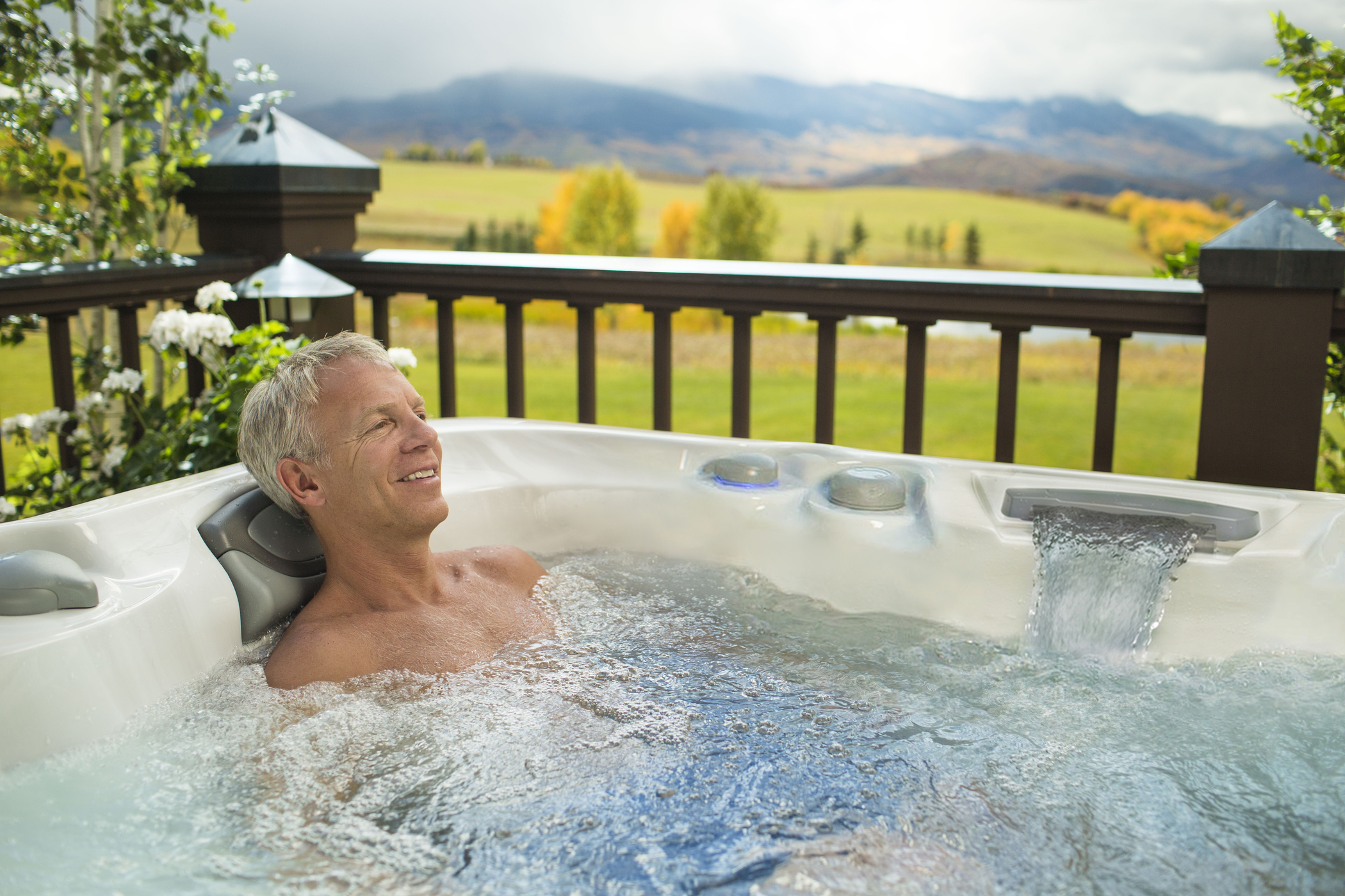 Man with arthritis soaking in the hot tub.