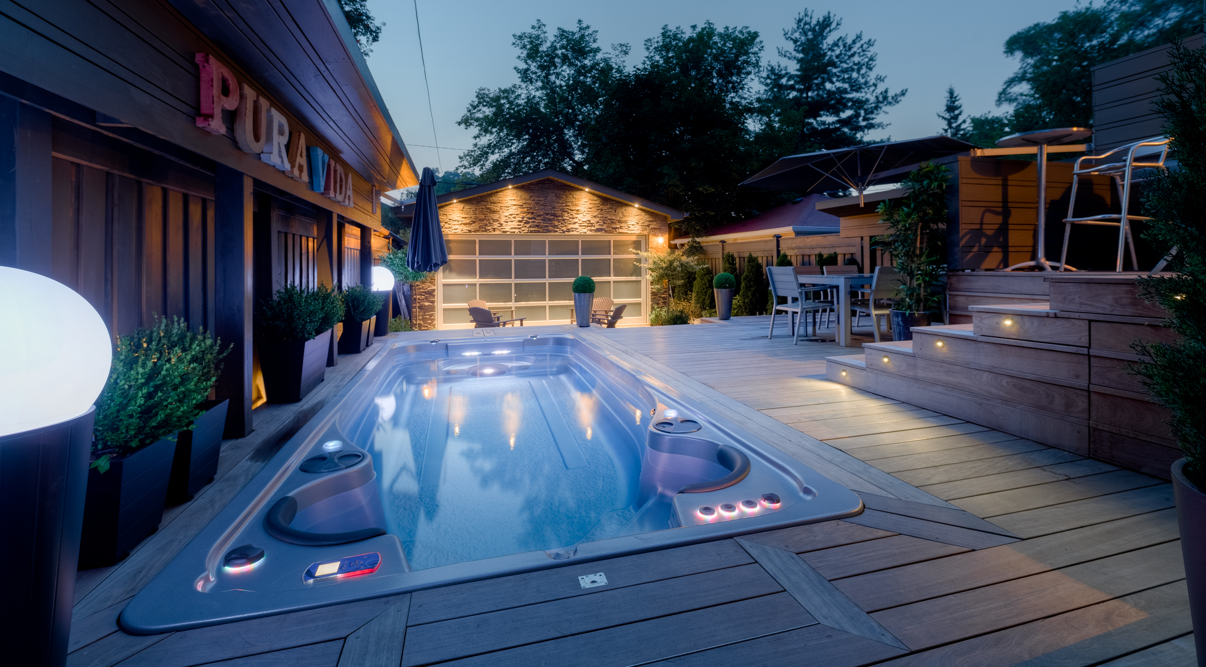 Outdoor swim spa installation at dusk.