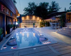 Outdoor swim spa installation at dusk.